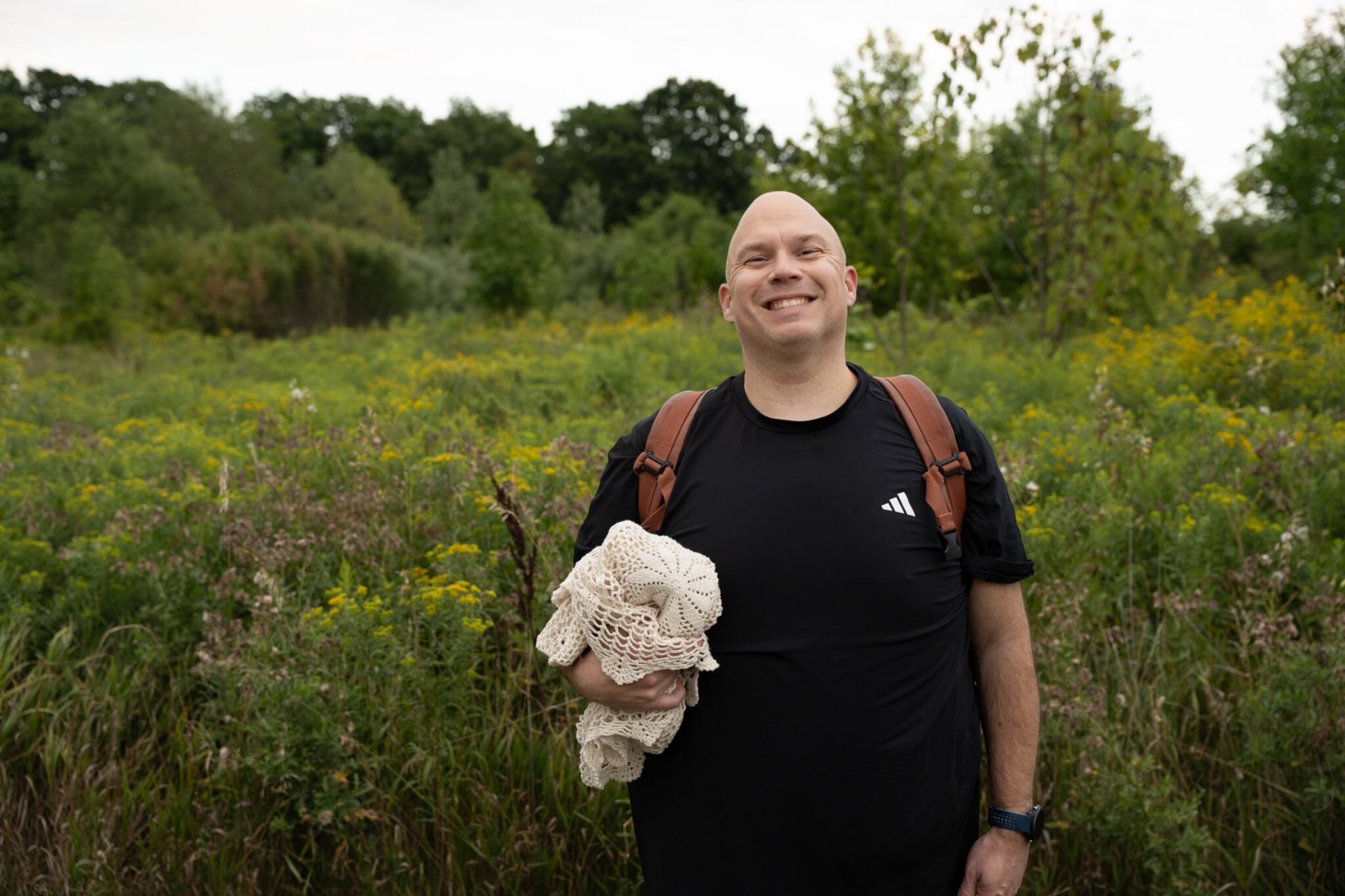 Chris smiling in a field