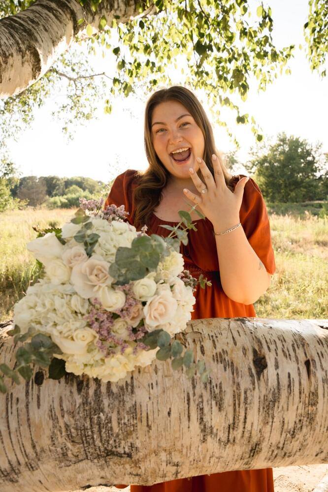 Newly engaged woman holding her bouquet