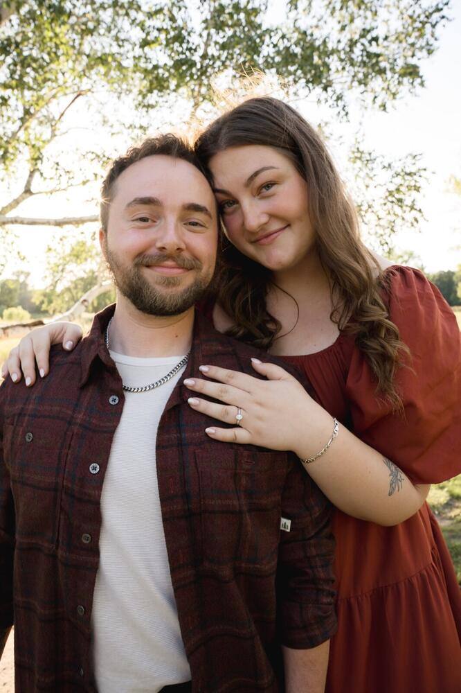 Engagement portrait beneath the trees
