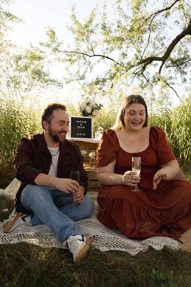 Newly engaged couple celebrating together