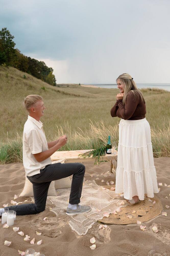 Joyful reaction during a beach proposal