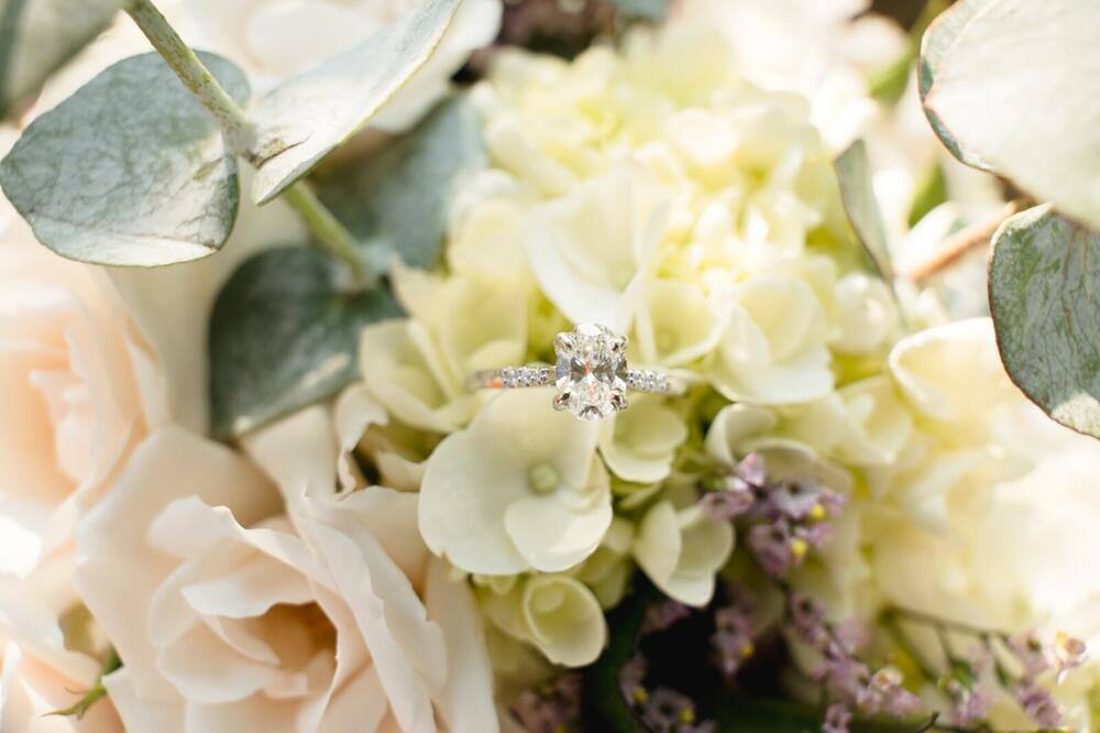 Engagement ring nestled in flowers
