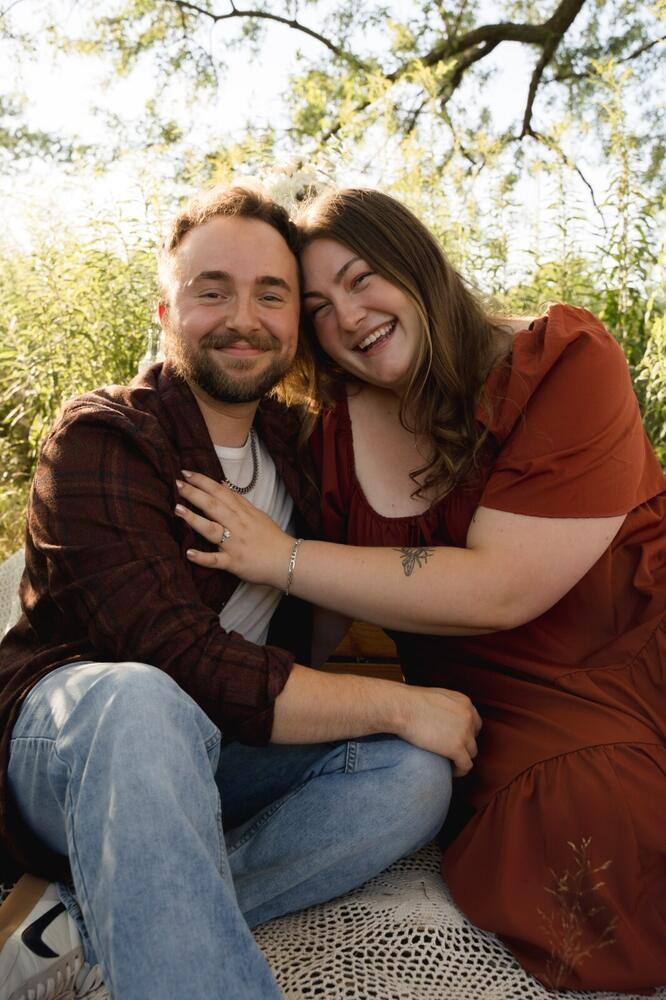 Engaged couple seated together