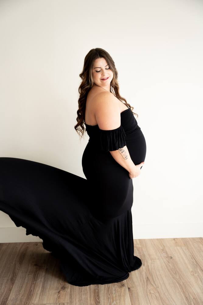 Maternity portrait in a flowing black dress