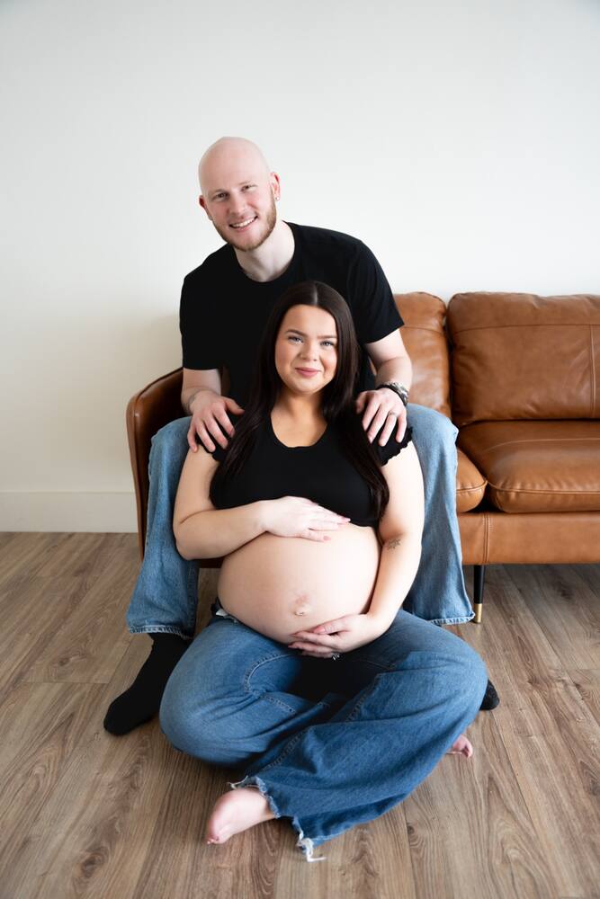 Expecting couple seated together