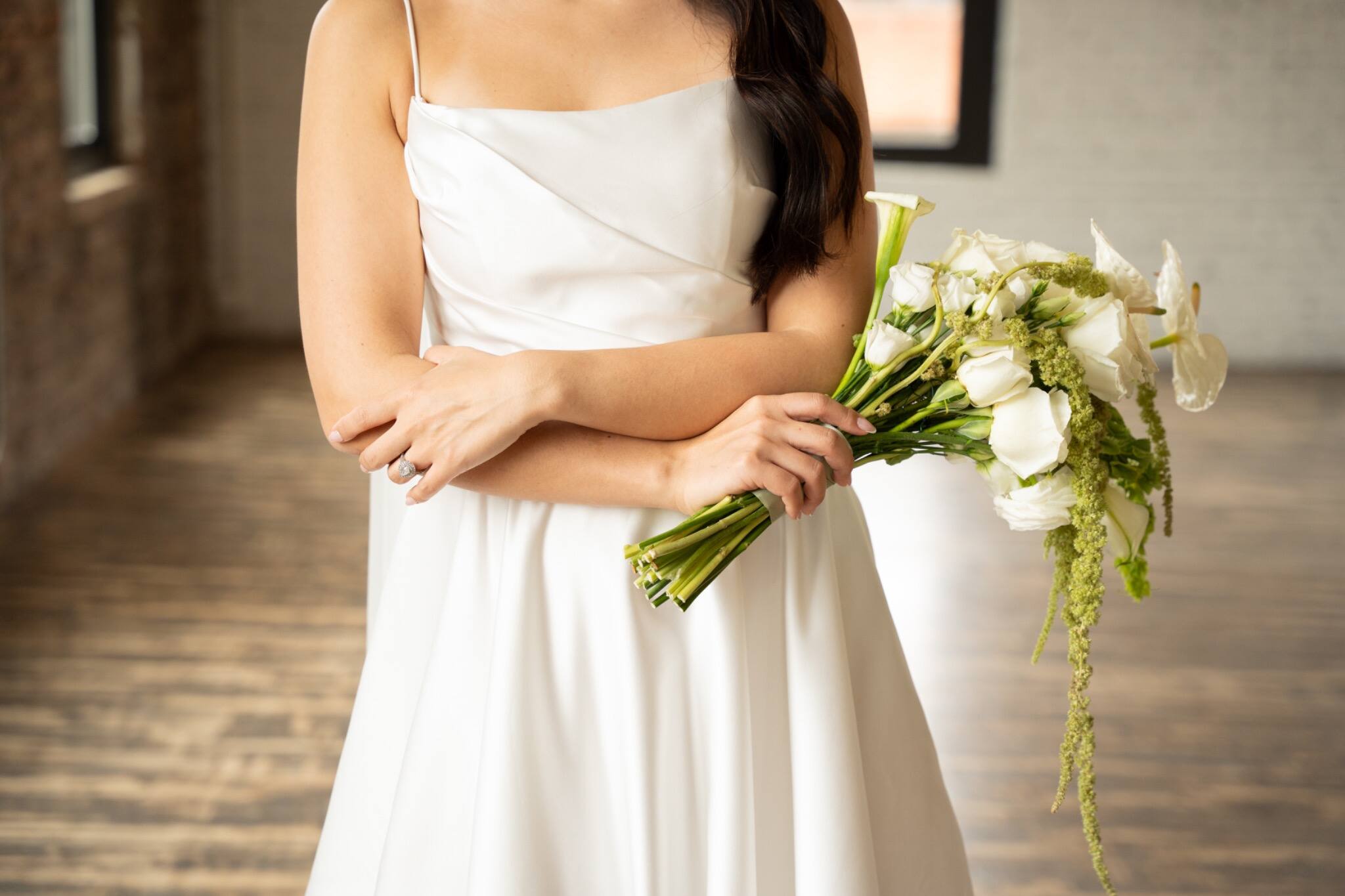 Wedding bouquet and bridal dress detail