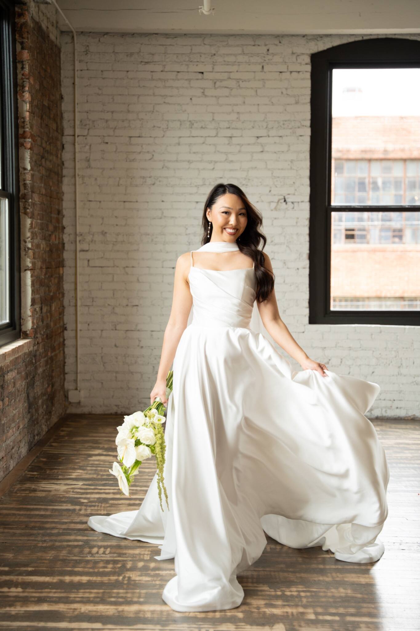 Editorial bridal portrait beside a window