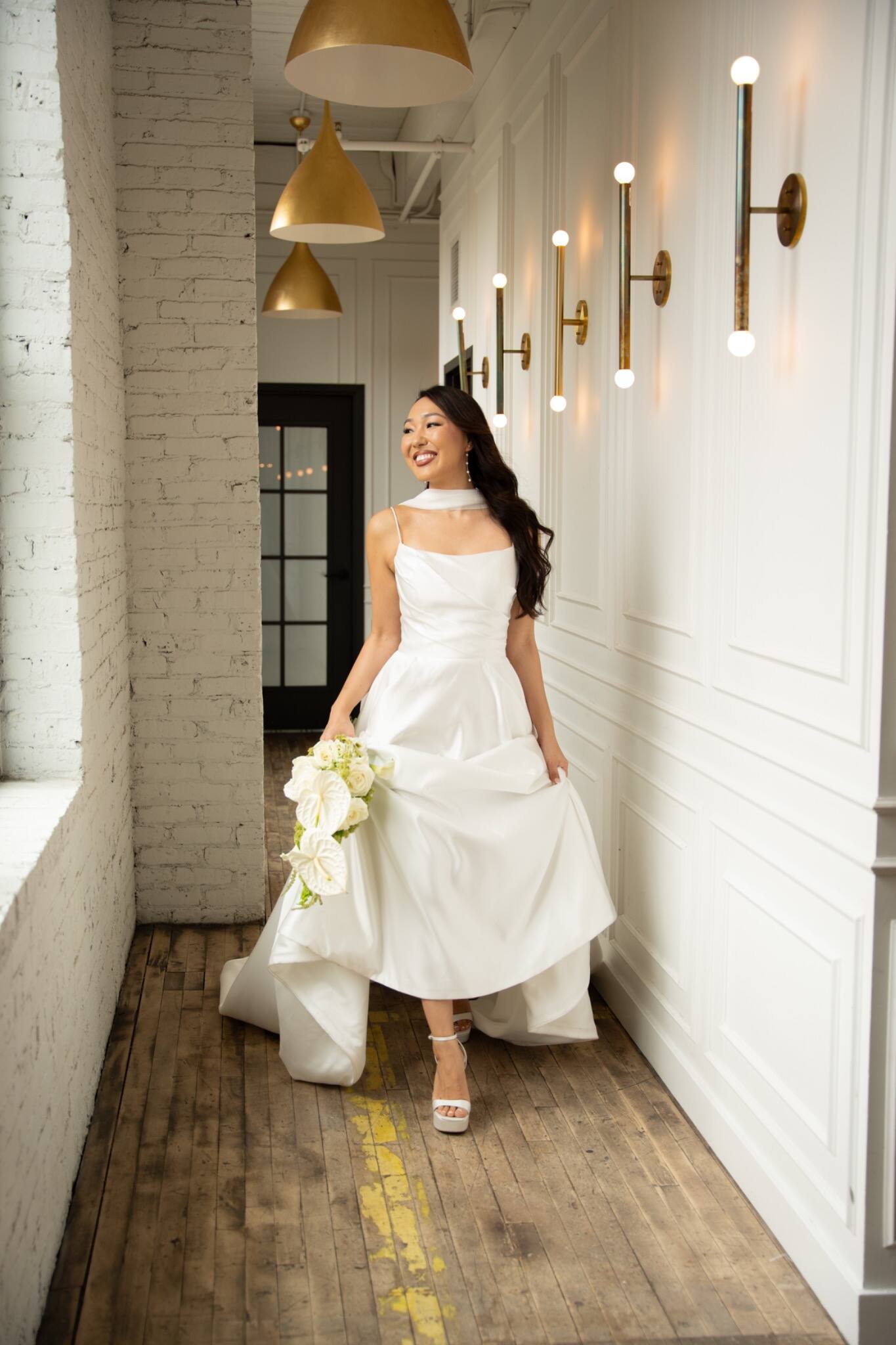Candid portrait of a bride walking through her venue