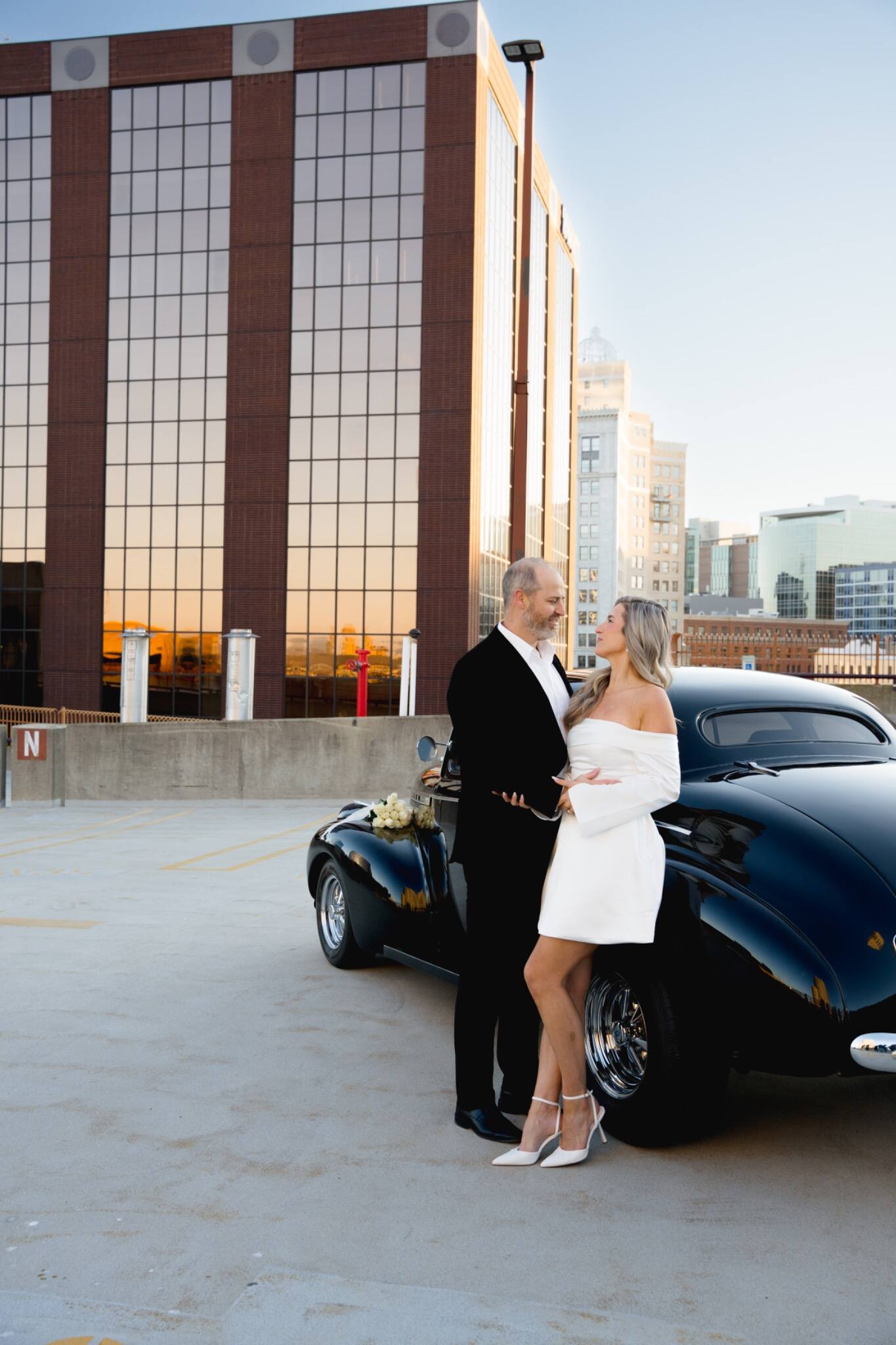 Newlyweds standing together outside an industrial venue
