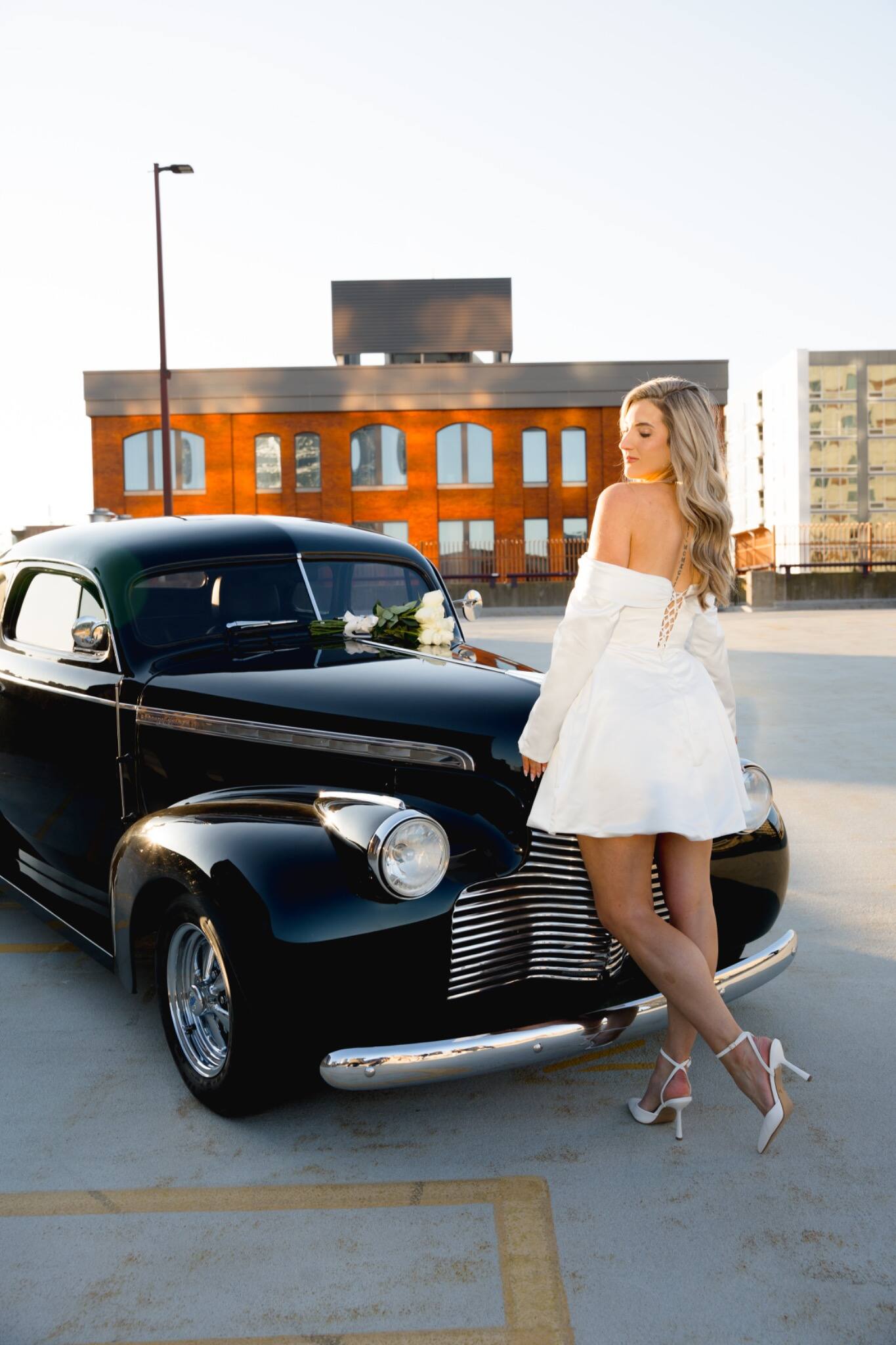 Solo bridal portrait beside a classic car