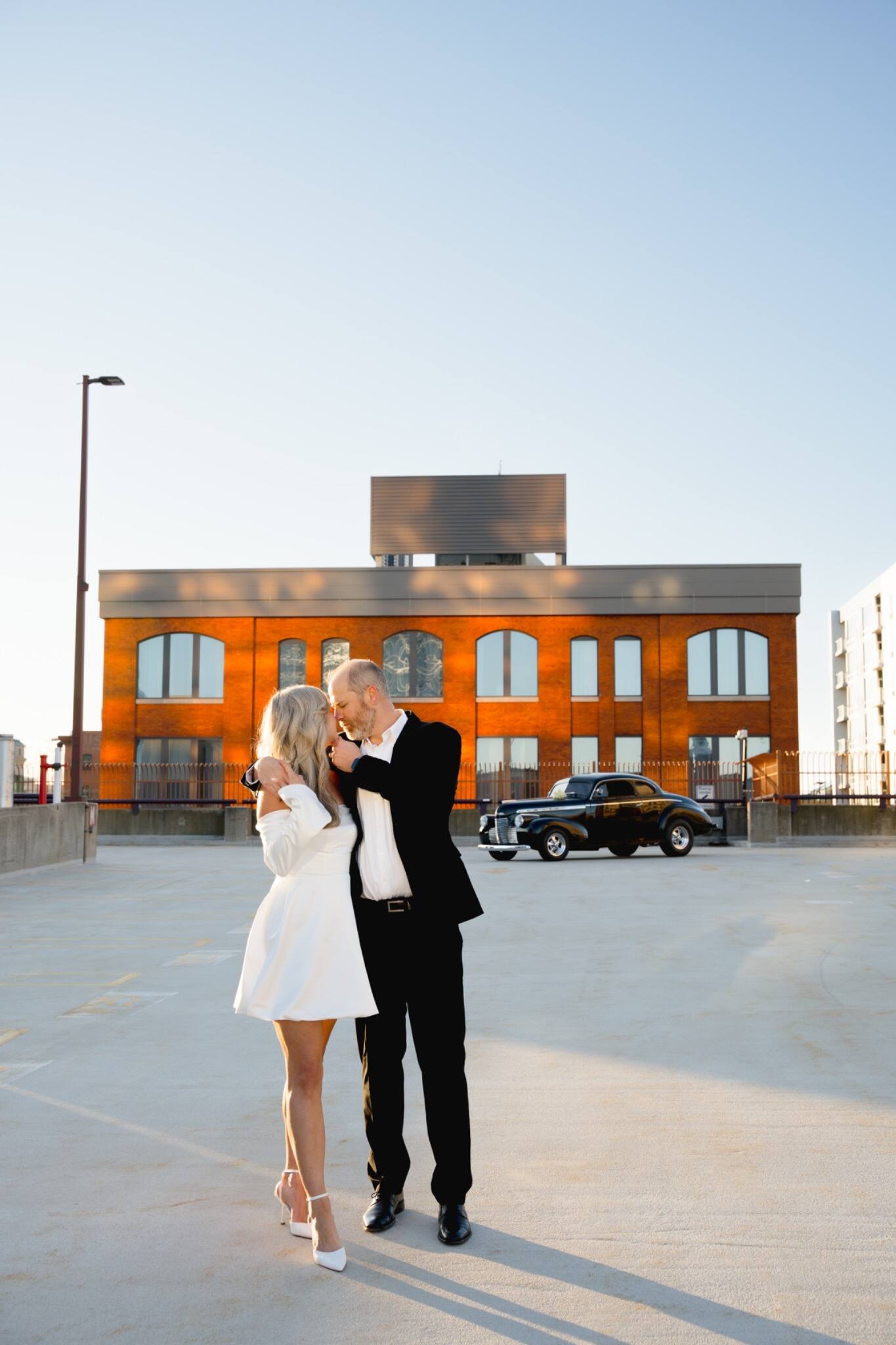 Wide editorial portrait of newlyweds outdoors