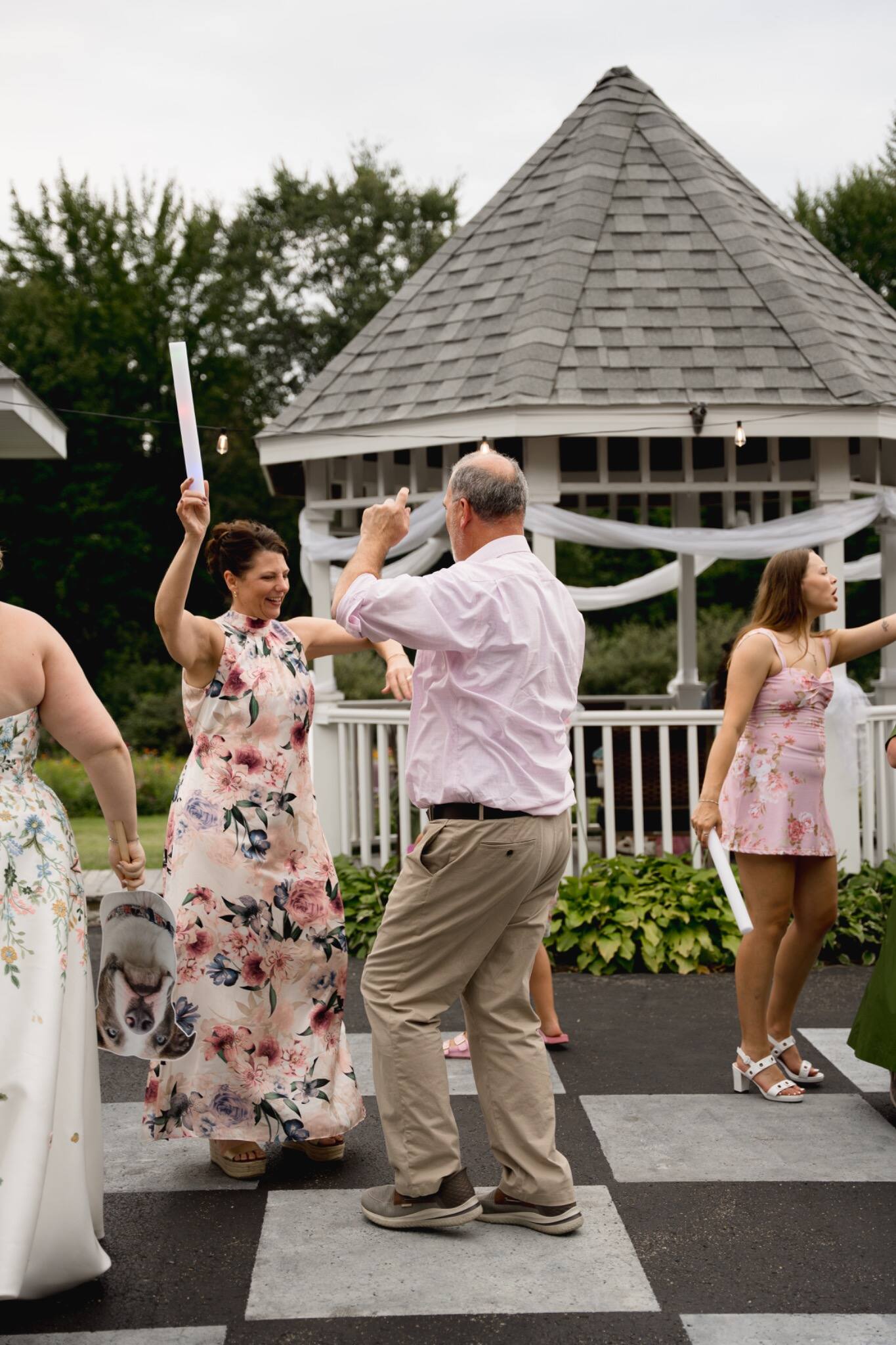 Wedding guests celebrating together on the dance floor