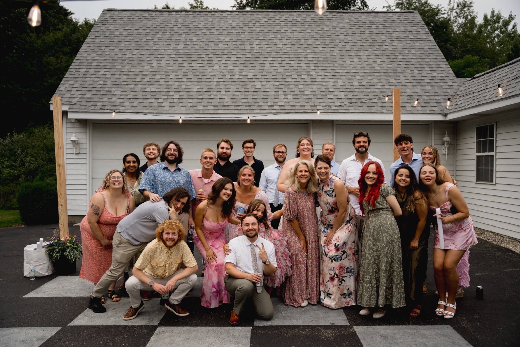 Wedding guests gathered for a joyful group portrait