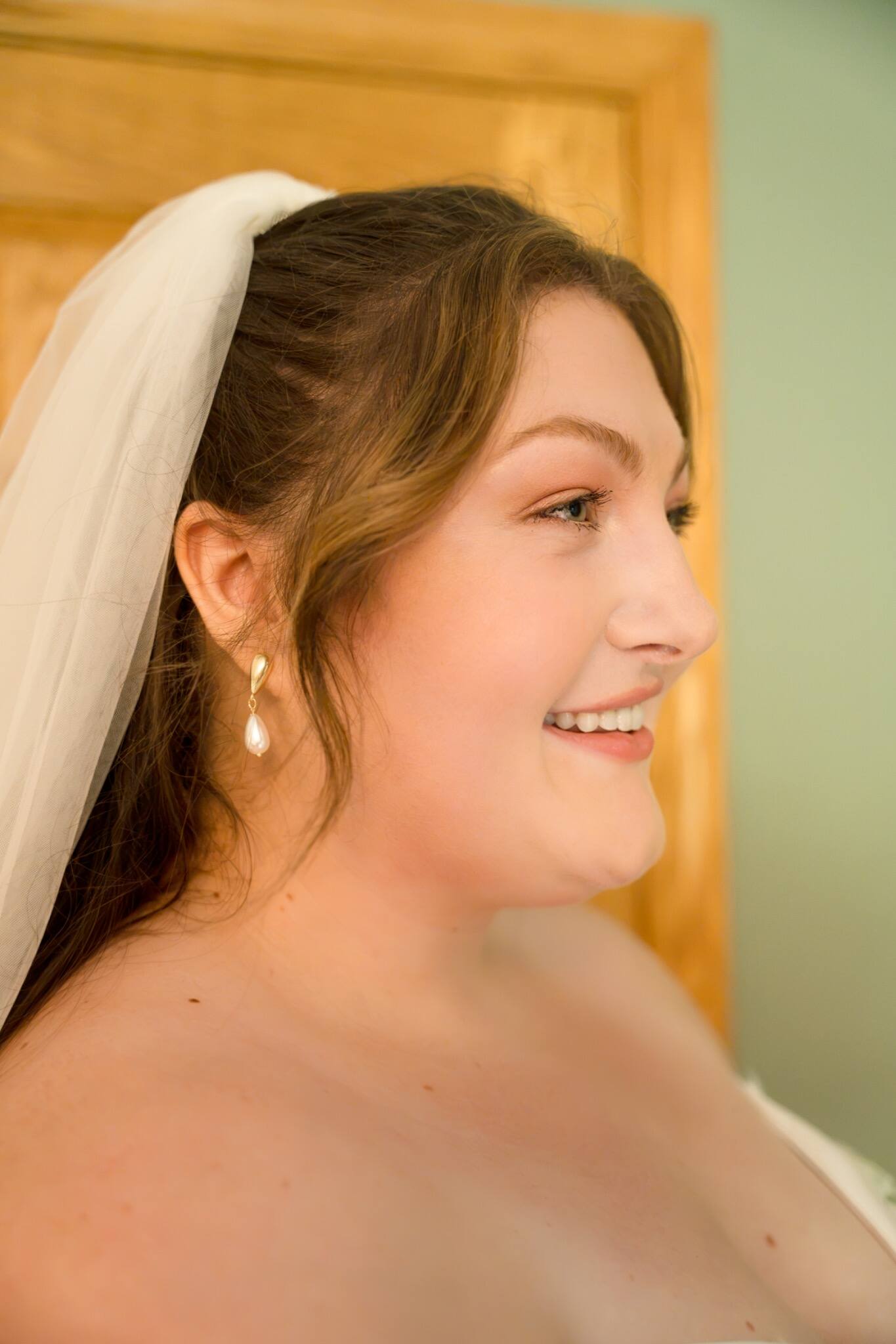 Close bridal portrait in warm window light