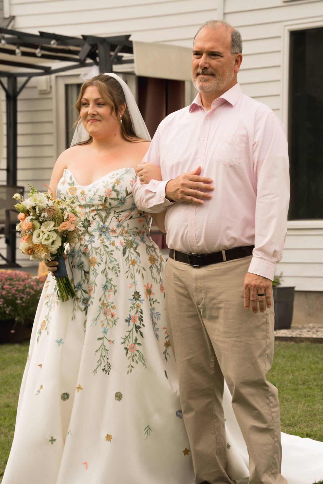 Bride walking to the ceremony with her father