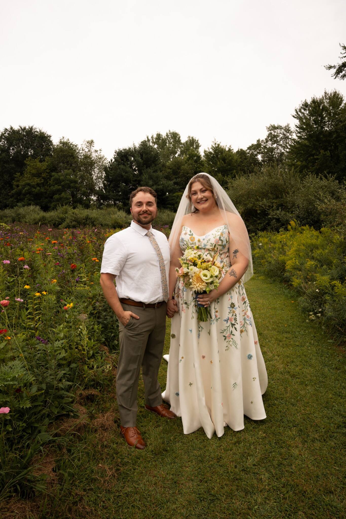 A relaxed newlywed portrait in the flower garden