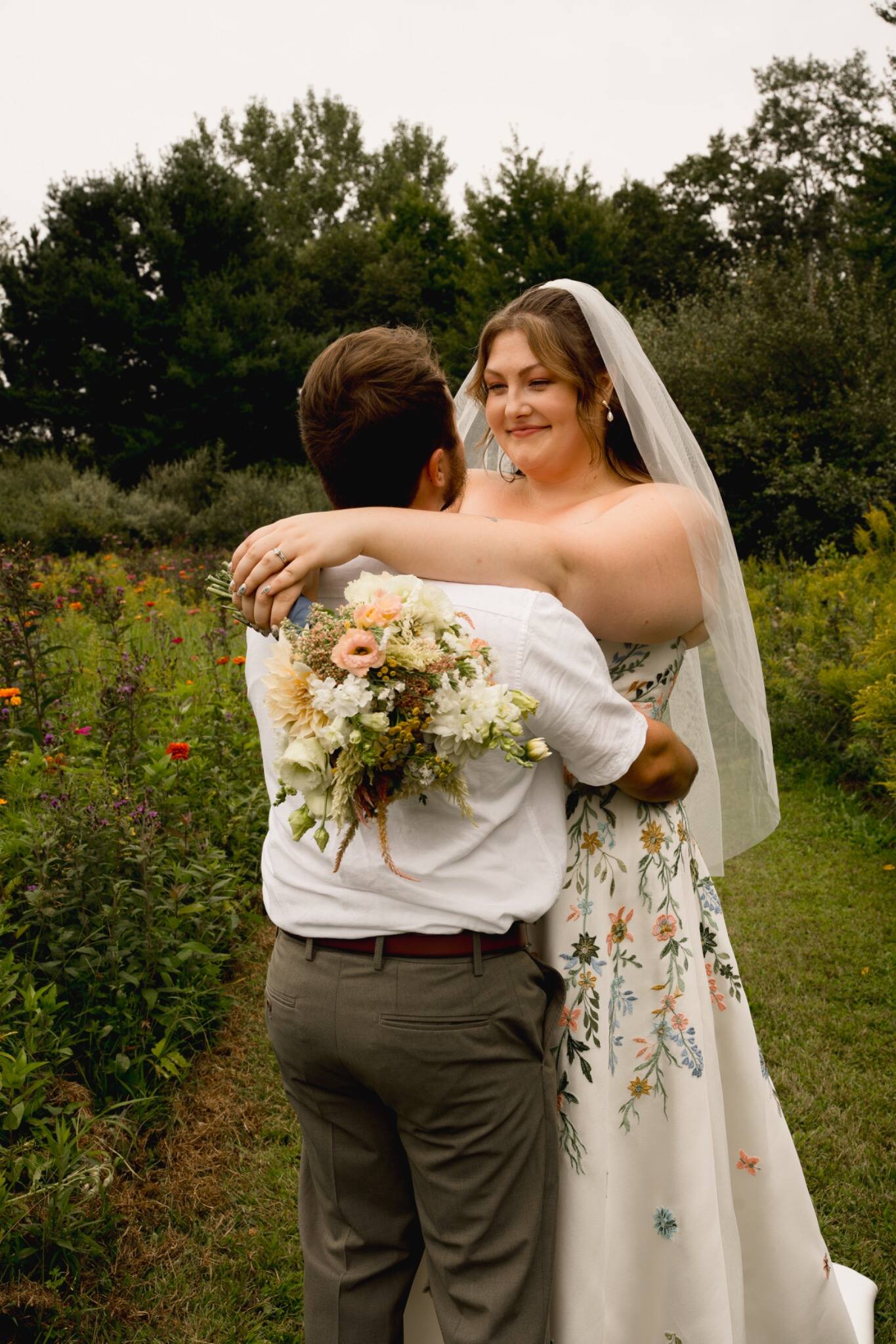 Bride hugging a loved one during the celebration