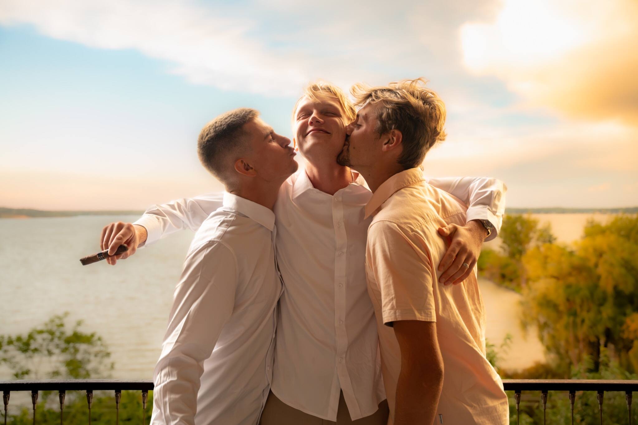 Wedding friends sharing a playful sunset portrait