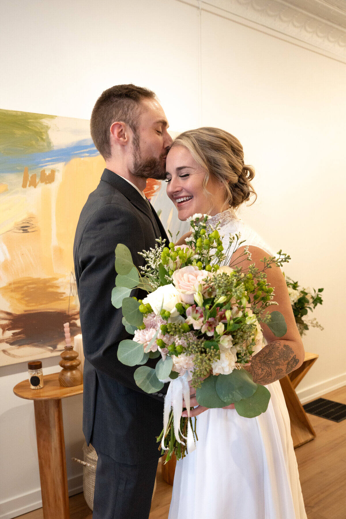 A tender first-look moment between newlyweds